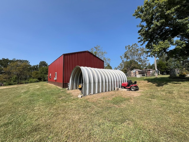 view of outdoor structure featuring a yard