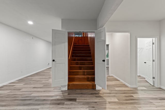 stairway with wood-type flooring