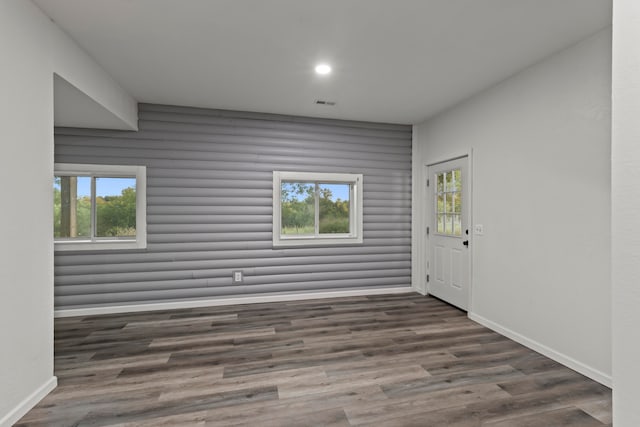 spare room featuring dark hardwood / wood-style floors