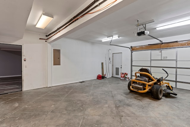 garage featuring a garage door opener and electric panel