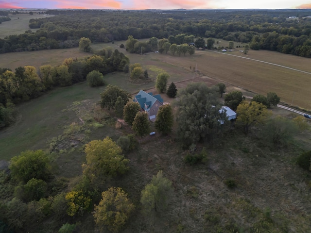 aerial view at dusk featuring a rural view