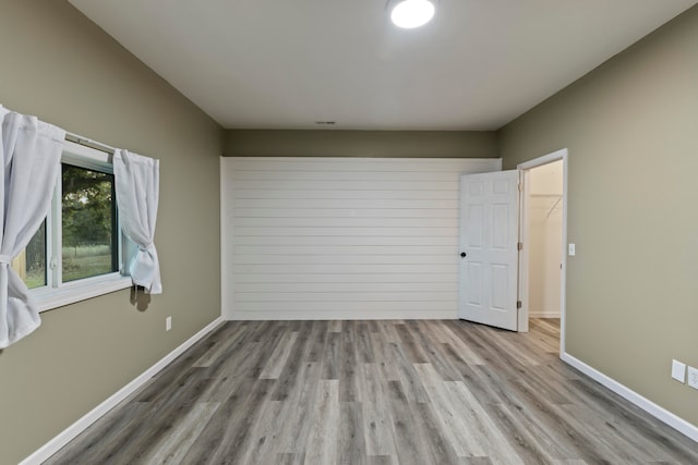 spare room featuring light wood-type flooring