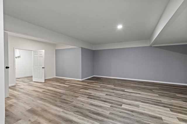 basement featuring light hardwood / wood-style flooring