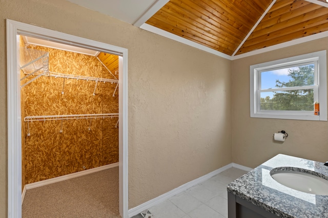 bathroom featuring tile patterned floors, vanity, vaulted ceiling, and wood ceiling