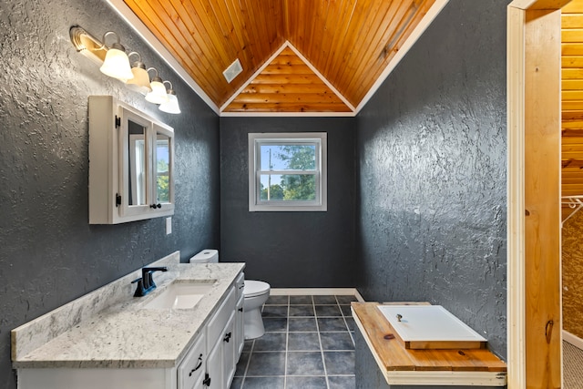 bathroom featuring vanity, lofted ceiling, toilet, wooden ceiling, and tile patterned flooring