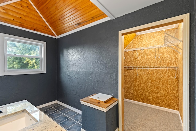 bathroom with sink, lofted ceiling, and wood ceiling