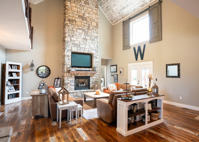 living room with high vaulted ceiling, french doors, dark hardwood / wood-style floors, wooden ceiling, and a fireplace