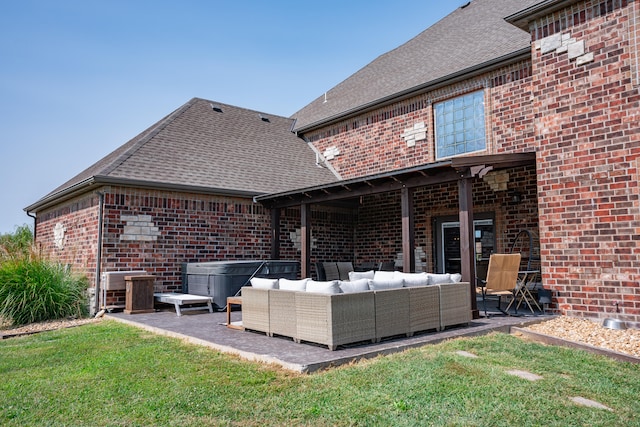 exterior space with an outdoor living space, a patio, and a lawn