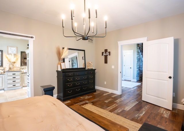 bedroom with dark wood-type flooring and a chandelier