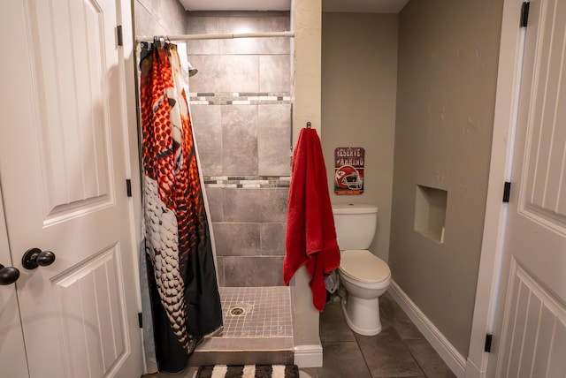 bathroom featuring tile patterned floors, toilet, and a shower with shower curtain