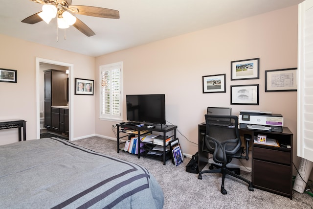 carpeted bedroom featuring ensuite bath and ceiling fan