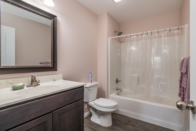 full bathroom with vanity, hardwood / wood-style floors, shower / tub combo with curtain, and toilet