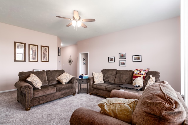 carpeted living room featuring ceiling fan