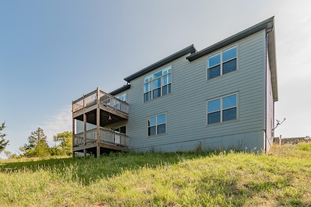 back of house featuring a deck