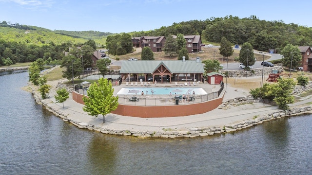 birds eye view of property featuring a water view