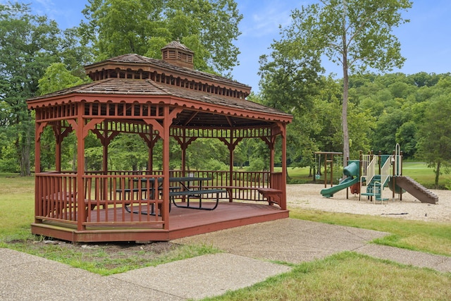 view of home's community featuring a gazebo, a playground, and a wooden deck