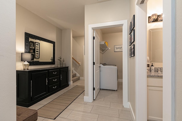 bathroom with washer / clothes dryer and vanity