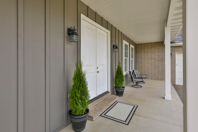 doorway to property featuring a porch