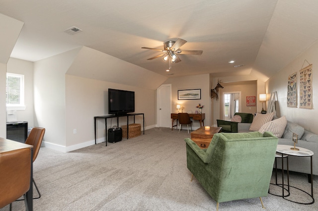 living room with vaulted ceiling, carpet, and ceiling fan