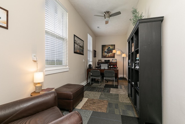 office area featuring a textured ceiling and ceiling fan