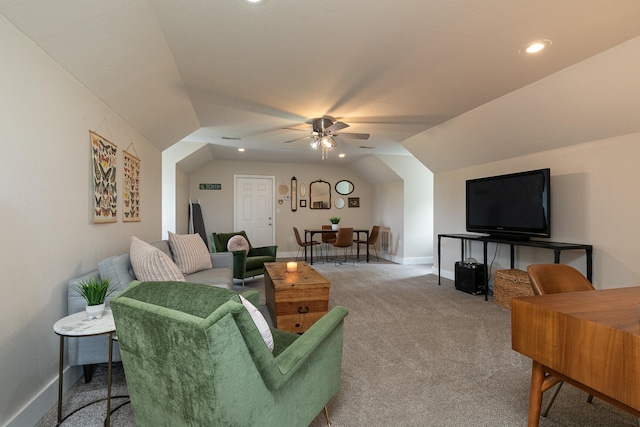 living room featuring ceiling fan, vaulted ceiling, and carpet