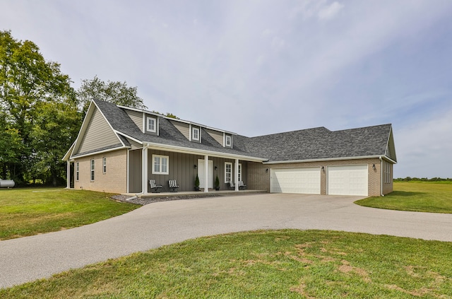 view of front of home featuring a garage, a porch, and a front yard