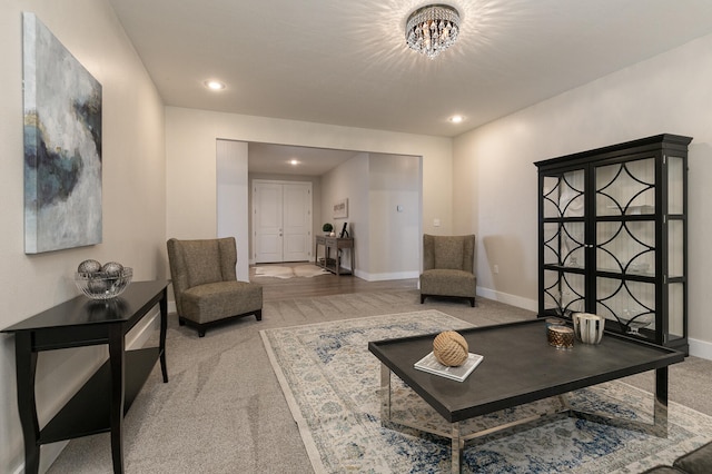 living room with a chandelier and carpet