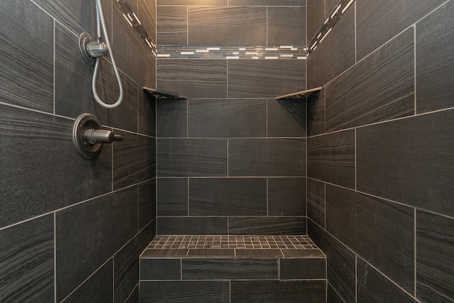 bathroom with tiled shower