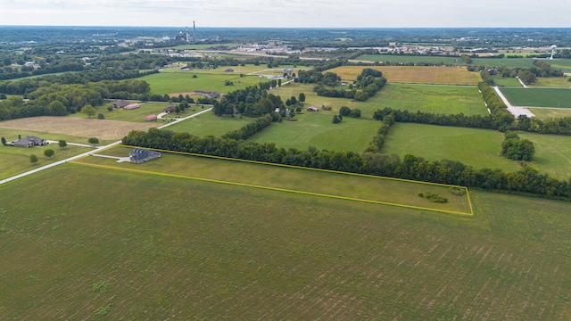 birds eye view of property featuring a rural view and a water view