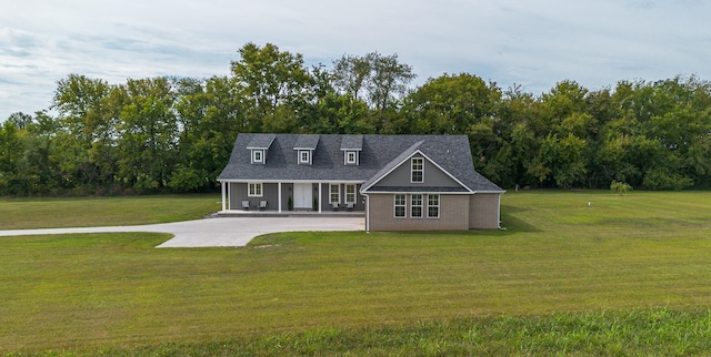 rear view of house with a yard