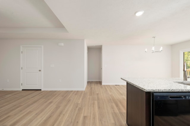 kitchen with light stone counters, a notable chandelier, hanging light fixtures, black dishwasher, and light hardwood / wood-style flooring