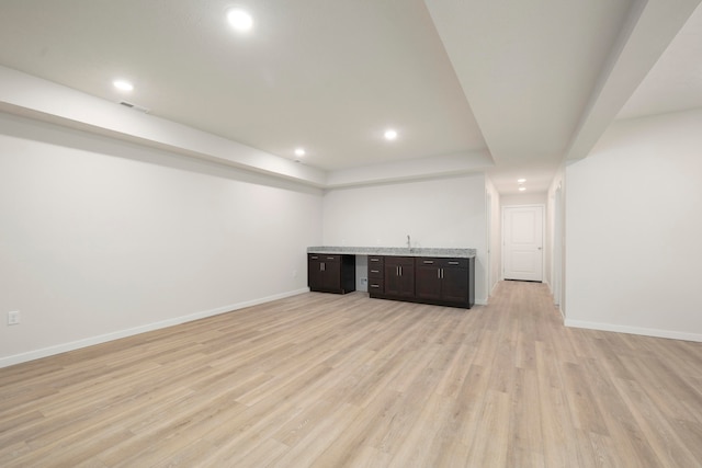 basement featuring light hardwood / wood-style flooring