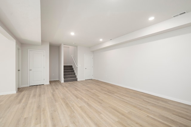 basement featuring light hardwood / wood-style floors