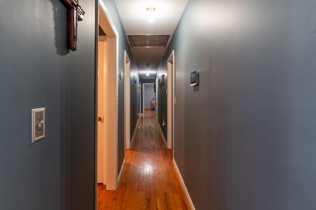 hall with wood-type flooring