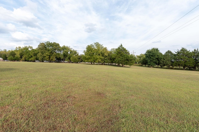 view of yard with a rural view