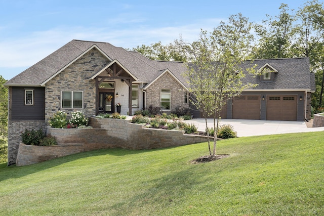 craftsman inspired home featuring a garage and a front lawn