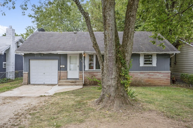 view of front of house with a garage and a front yard