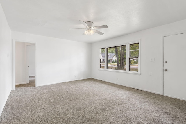 unfurnished room with carpet floors and ceiling fan