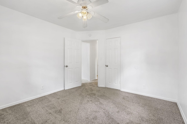 unfurnished room with carpet floors and ceiling fan