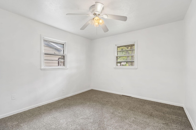 empty room with carpet flooring and ceiling fan