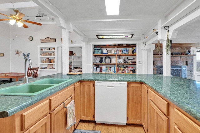 kitchen with dishwasher, ceiling fan, sink, and light hardwood / wood-style flooring