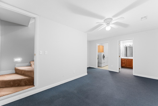 unfurnished bedroom with ensuite bathroom, ceiling fan, washer / clothes dryer, and dark colored carpet