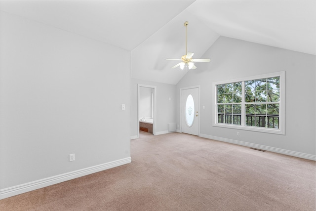 unfurnished living room featuring ceiling fan, light colored carpet, and lofted ceiling