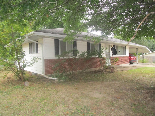 ranch-style home with a carport