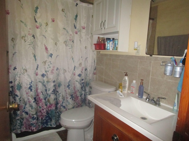 bathroom featuring toilet, tasteful backsplash, tile walls, vanity, and a shower with curtain