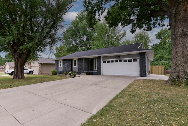 ranch-style house with a front yard and a garage