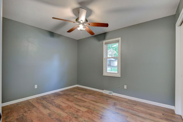 empty room with light hardwood / wood-style flooring and ceiling fan