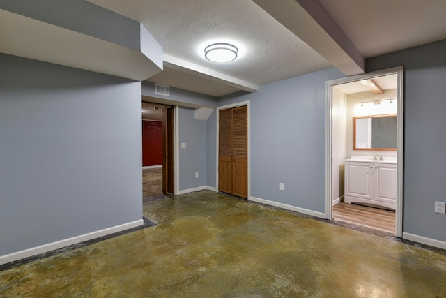 basement with a textured ceiling