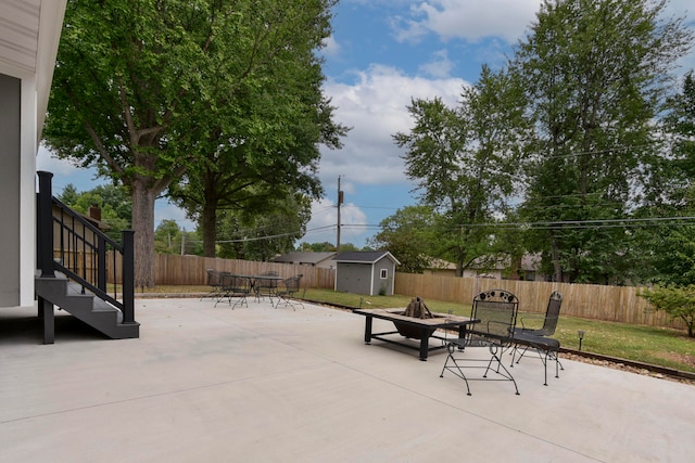 view of patio with a storage unit