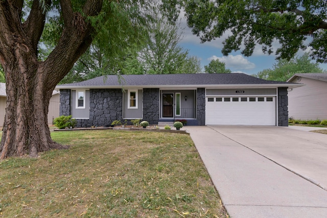 ranch-style house with a front lawn and a garage